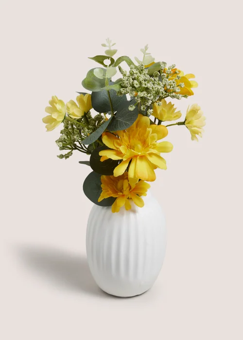 Yellow Flowers In A Rib Vase Image 1