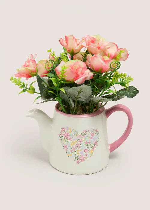 Pink Flower In Watering Can Image 1