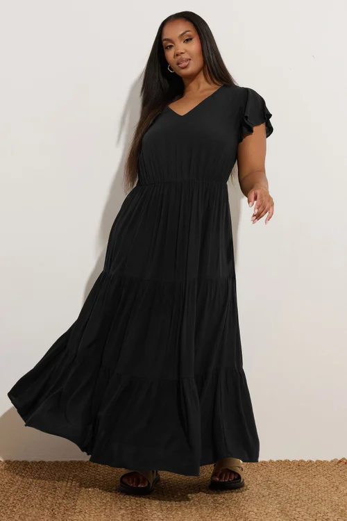 curve black maxi dress ASOS DESIGN Curve raw edge ruffle maxi dress with tie back in black