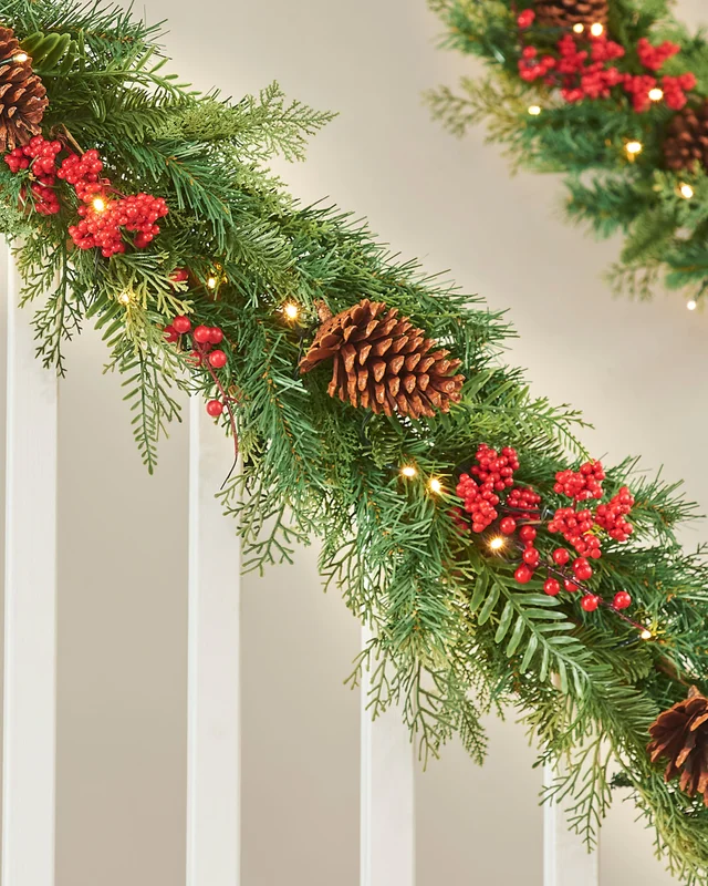WeRChristmas Red Pre-Lit Artificial Christmas Garland With Pinecones And Red Berries 50 Warm White Leds 9 Ft