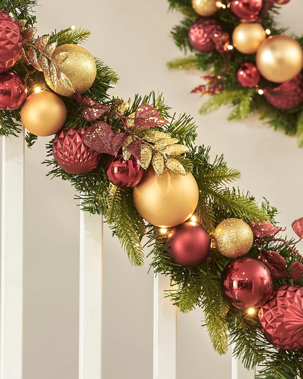 WeRChristmas Multi-Colour Pre-Lit Artificial Christmas Garland With Burgundy And Gold Baubles 100 Warm White Leds 9 Ft - No Size Image 1