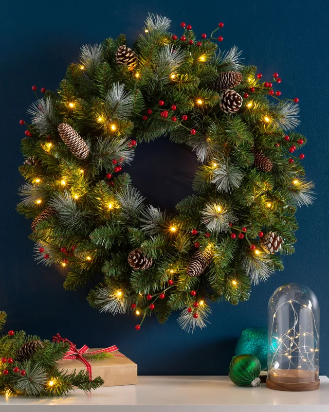 WeRChristmas Red Pre-Lit Frosted Artificial Christmas Wreath With Pinecones And Red Berries 40 Warm White Leds 60 Cm