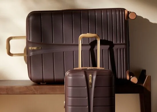 Green hardshell suitcase with matching underseat bag