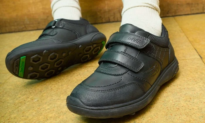 Riptape school shoes with school floor background
